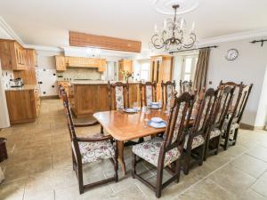 a dining room with a wooden table and chairs at Hillside Farm in Kirkby Stephen