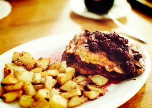 a plate of food with potatoes on a table at Coloso del Mar in Zancudo