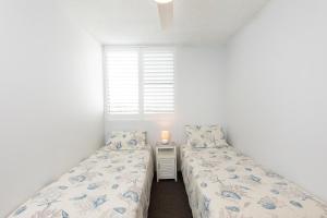 Postel nebo postele na pokoji v ubytování Oceanic 22 - linen not included + 8 fotografií