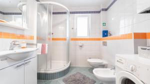 a bathroom with a shower and a sink and a toilet at Apartment Luna in Srima +15 photos