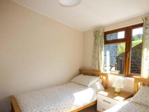 a bedroom with two twin beds and a window at North Lodge in Staveley