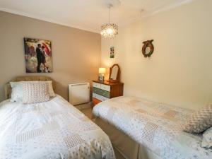 Voodi või voodid majutusasutuse Miners Cottage toas