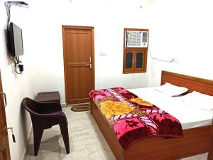 Letto o letti in una camera di Natraj Homes