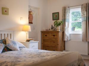 Postel nebo postele na pokoji v ubytování Mr McGregors' Cottage