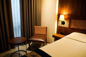 Lova arba lovos apgyvendinimo įstaigoje de JAVA Hotel Bandung