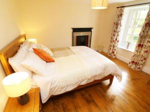 Katil atau katil-katil dalam bilik di Mill Dam Farm Cottage