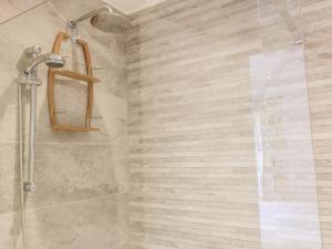 a shower with a glass door in a bathroom at Chy Lagen Hos in Newquay +16 photos