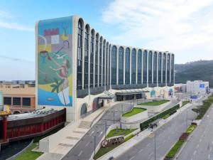 a large building with a painting on the side of it at Lisboeta Macau in Macau
