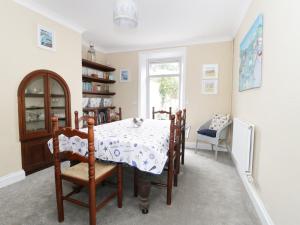 a dining room with a table and chairs at No 9, Watchet in Watchet