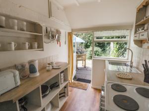a kitchen with a sink and a counter top at The Cottage in Pershore