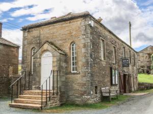 an old brick church with a white door at High Head in Richmond