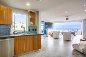 a kitchen with a view of the ocean at Ostend Escape in San Diego