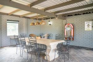 a dining room with a table and chairs at "Wiltara" Estate Rural Escape for 2 to 14 Guests in Orange