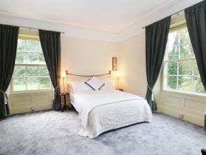 A bed or beds in a room at Godscroft Hall