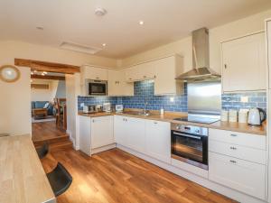 Kuchyň nebo kuchyňský kout v ubytování Rose Cottage + 10 fotografií