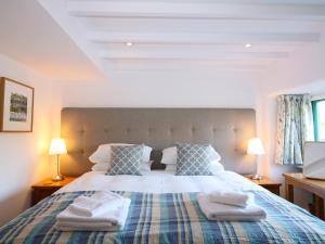En eller flere senge i et værelse på The Granary