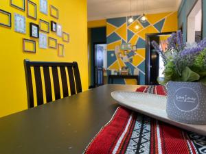 a table with a surfboard sitting on top of it at JJ Homes Marina Court in Kota Kinabalu