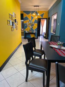 a dining room with a table and chairs at JJ Homes Marina Court in Kota Kinabalu