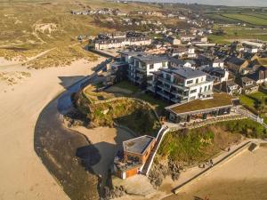 an aerial view of a house on the beach at Chapel Rock View, The Dunes in Perranporth