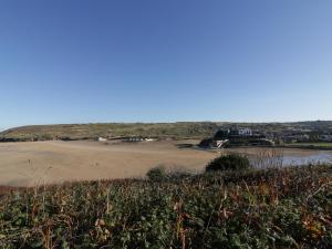a view of the beach from a hill at Chapel Rock View, The Dunes in Perranporth