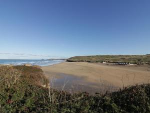a view of the beach from a bluff at Chapel Rock View, The Dunes in Perranporth