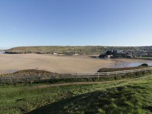 a view of the beach from the top of a hill at Chapel Rock View, The Dunes in Perranporth