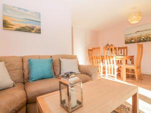 a living room with a couch and a table at Bearscombe in Ivybridge