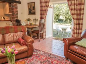 Et opholdsområde på Holly Cottage