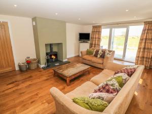 Posezení v ubytování Rhos Y Foel Cottage