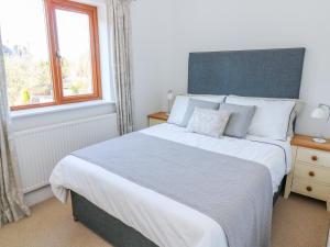Un pat sau paturi într-o cameră la Langtree