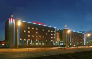 a building with a hilton sign on it at night at Kotorosl Hotel in Yaroslavl