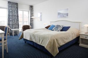 Postel nebo postele na pokoji v ubytování Tornøes Hotel