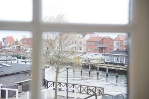 a view of a river from a window at Tornøes Hotel in Kerteminde