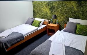 Ένα ή περισσότερα κρεβάτια σε δωμάτιο στο Stadnina koni Leśna Wola