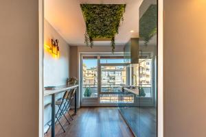a kitchen with a counter and a large window at B&B il Duca d'Amalfi in Salerno