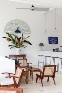 a room with a table and chairs and a counter at Halcyon Mawella in Tangalle