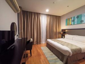 Voodi või voodid majutusasutuse Trinidad Suites Johor, Trademark Collection by Wyndham toas