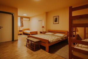 a bedroom with a bed and a bunk bed at Sobe Gondola Sotin in Sotin