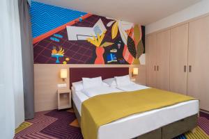 Posteľ alebo postele v izbe v ubytovaní Kolping Family Resort