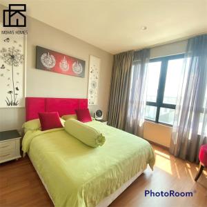a bedroom with a large bed with a red headboard at Hyde Tower I-city by Mohas Homes in Shah Alam