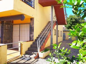 a building with a staircase in front of it at Apartament per 4 persones a Doctor Fleming a 5 minuts de la Platja Gran in Platja  d'Aro
