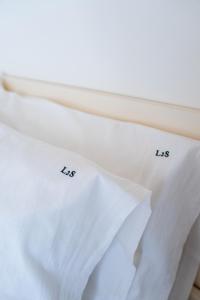 a white shirt with the letters ls on a window at Le2Stanze in Vittoria