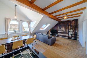 an attic living room with a ping pong table at Stylisches Penthouse zentral Tischfussball 100m2 Wii in Hannover