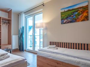 Posteľ alebo postele v izbe v ubytovaní Apartamenty na Polnej