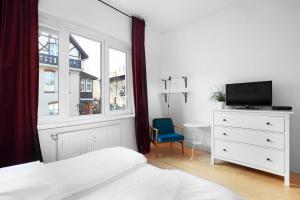 A bed or beds in a room at VIU Fiszera - apartament z werandą