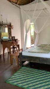 Mabamba Lodge tesisinde bir odada yatak veya yataklar