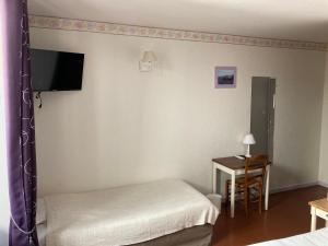 TV a/nebo společenská místnost v ubytování Hotel D'Albion