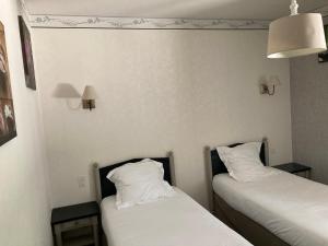 Postel nebo postele na pokoji v ubytování Hotel D'Albion