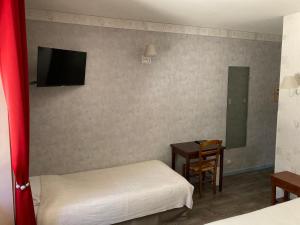 Postel nebo postele na pokoji v ubytování Hotel D'Albion
