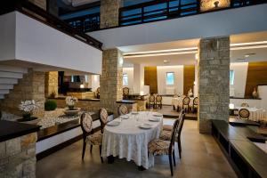 a dining room with a table and chairs at Hotel & Restaurant Sofia in Suceviţa